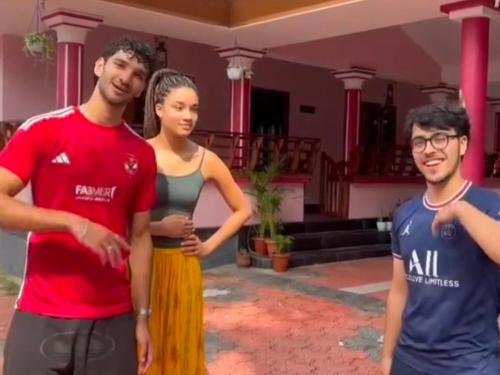 a group of people standing in front of a house at Vintage villa in Varkala