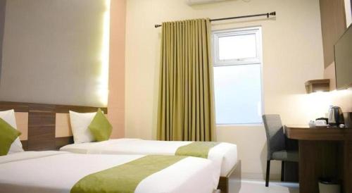 Ένα ή περισσότερα κρεβάτια σε δωμάτιο στο dPalma Hotel