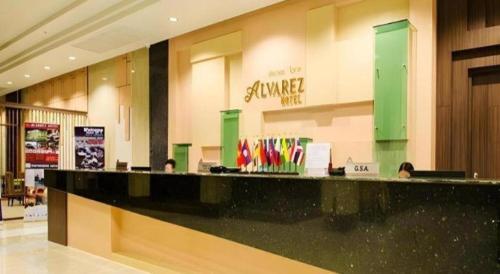 a store with a black counter in a shopping mall at Alvarez Hotel in Buriram