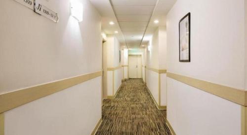 a hallway of an office building with a long corridor at JinJiang Inn Datong Pingchengqiao in Datong