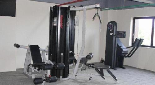 a room with a gym with equipment in it at CK Tanjungpinang Hotel and Convention Centre in Tanjung Pinang 