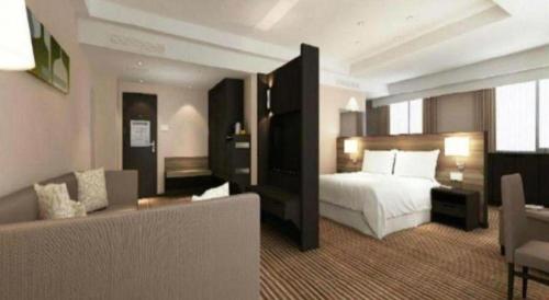 Кровать или кровати в номере Xiamenair Maple Hotel (Xiamen SM City Plaza)
