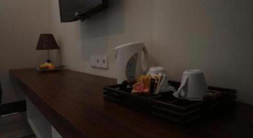 a kitchen counter with a tray of food on it at Umah Bali Suites in Denpasar