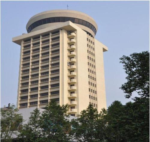 a large building with a dome on top of it at Gui Feng Hotel in Jiangmen