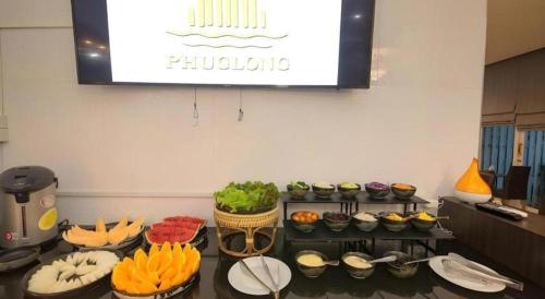 a display of food on a table in a room at Phuglong Hotel in Phayao