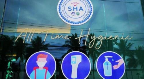 a sign on the window of a store at Phuglong Hotel in Phayao