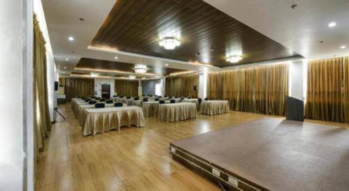 a large banquet hall with tables and chairs in it at Eighty Eight Hotel in Koronadal