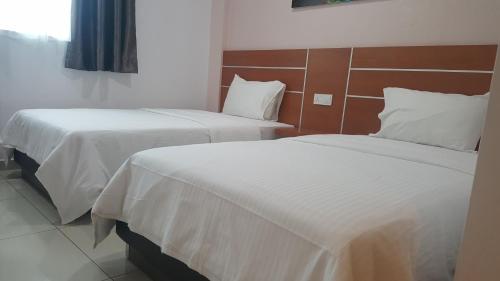Katil atau katil-katil dalam bilik di DOTA Hotel