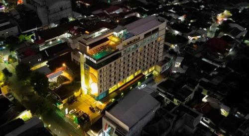 an overhead view of a building in a city at night at Java Lotus Hotel Jember in Jember