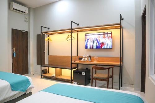 Commodious Hotel Kupangにあるベッド