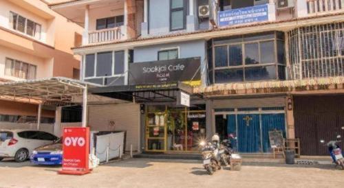 a motorcycle parked in front of a building at OYO 726 Sookjai Cafe and Hostel in Chiang Mai