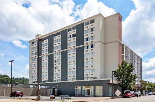 a large building with a blue and white at Quality Inn & Suites Charleston - Civic Center in Charleston