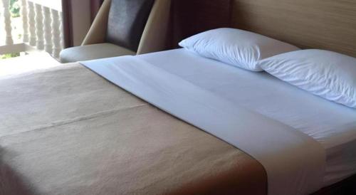 Ένα ή περισσότερα κρεβάτια σε δωμάτιο στο Honey Lodge