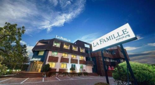 a building with a sign in front of it at La Famille in Yangyang