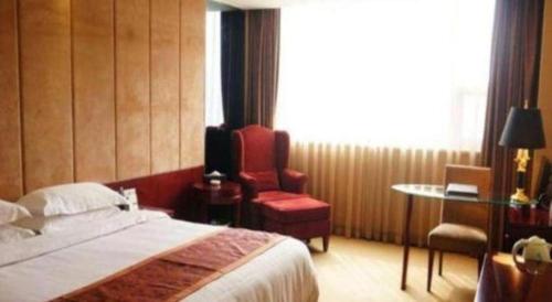 Ένα ή περισσότερα κρεβάτια σε δωμάτιο στο Forstar Hotel Renbei subbranch