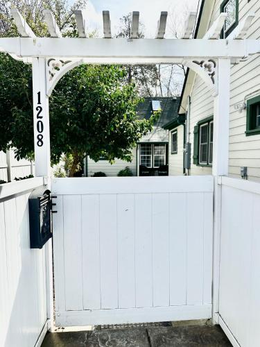 a white garage door with an archway in front of a house at Near Downtown- Kitchen-washerdryer-parking in Medford