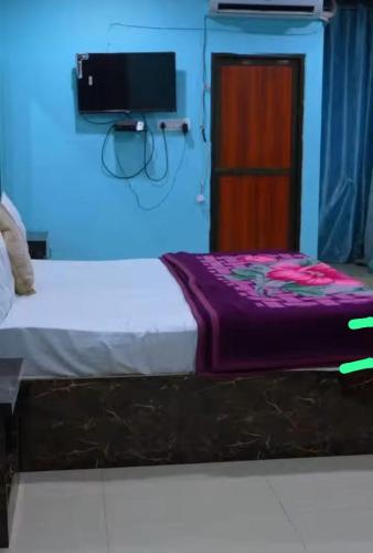 Katil atau katil-katil dalam bilik di Satyam Guest House