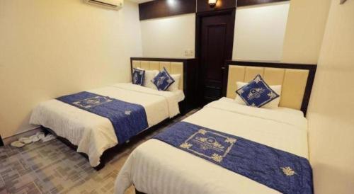 Katil atau katil-katil dalam bilik di Tuong Minh Hotel