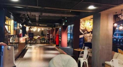 a room with chairs and tables in a building at YUNIK-Shanghai Zhongshan Park Yan'an Xi Road in Shanghai