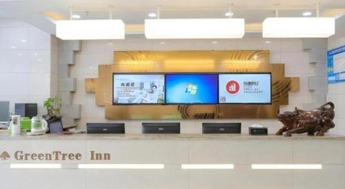 a large flat screen tv in a store at GreenTree Inn Jiaxin Puyuan Kaixuan Road in Jiaxing