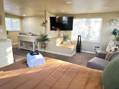 a living room with a bed and a living room with at Near Downtown- Kitchen-washerdryer-parking in Medford