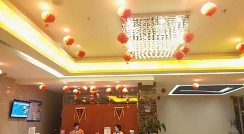 a room with red balloons on the ceiling of a building at 7 Days Inn Yining Xintiandi in Kipekyüzi