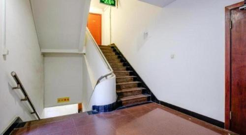 a staircase in a building with a stair case at Shijia Inn On the Bund in Shanghai