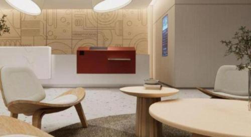 a waiting room with two chairs and a table at Home Inns Plus Shanghai Xujiahui Branch in Shanghai