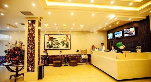 a lobby of a store with a reception counter at GreenTree Inn Xinjiang Uygur Autonomous Region Korla Bazhou Bus Terminal Beishan Road Express Hotel in Korla