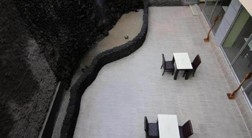 an overhead view of tables and chairs in a building at Sea View Hotel in Jeju