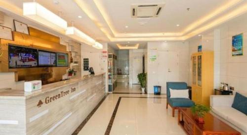 a lobby of a hospital with a bowling alley at GreenTree Inn Qufu High Speed Railway Station in Jining