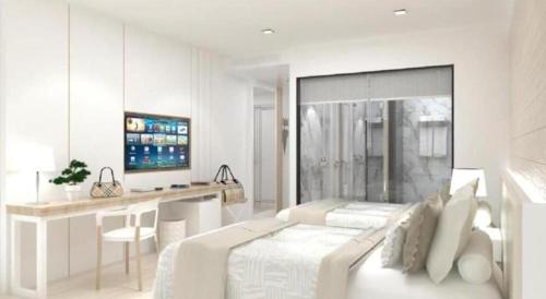 a white bedroom with a bed and a desk at Thaisun Bangkok Hotel in Bangkok
