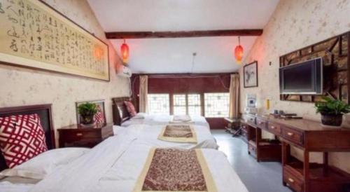 Cama o camas de una habitación en Pingyao Yufengheng Hotel