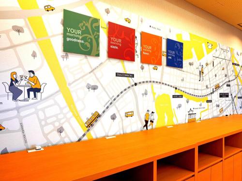 a wall mural in a office with a map at Comfort Hotel Hakata in Fukuoka