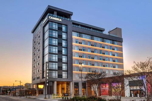 a building with a sign on the side of it at Cambria Hotel Nashville Midtown in Nashville