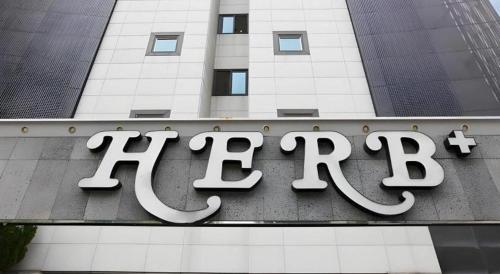 a hotel sign on the side of a building at Hotel Casa Suwon in Suwon