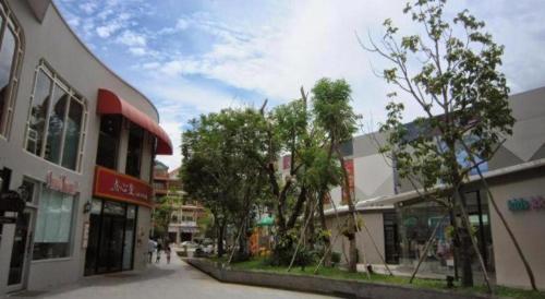 a street in a city with buildings and trees at Midland Hotel in Phnom Penh