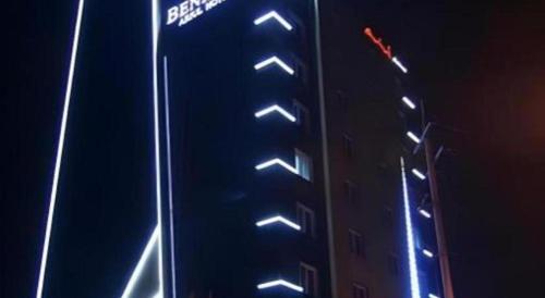 a building with lights on the side of it at night at Benikea Ariul Hotel in Gunsan