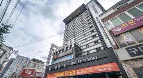a tall building in the middle of a city at Hotel Head-One in Uijeongbu
