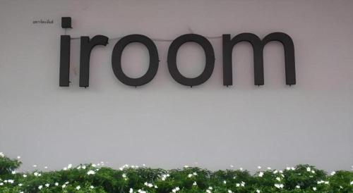 a sign for the hazon sign on a building at Iroom Hotel in Surat Thani