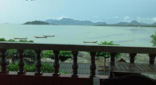 a view of a river with boats in the water at Wanghin Bungalow in Surat Thani