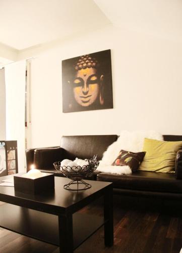 a living room with a couch and a coffee table at Hotel Sonnbichl in Lam