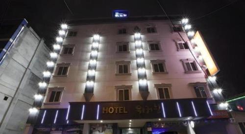a hotel building with lights on top of it at Chuncheon World Hotel in Chuncheon