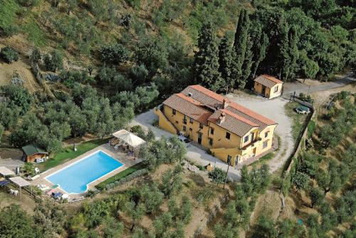 an aerial view of a house with a swimming pool at Podere Pilar in Montevettolini