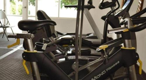 a gym with several exercise bikes in a room at Subic Grand Harbour Hotel Subic Bay in Olongapo