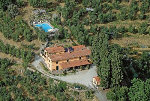 an aerial view of a house with a pool at Villa Pilar in Toscana con piscina ultrapanoramica in Montevettolini