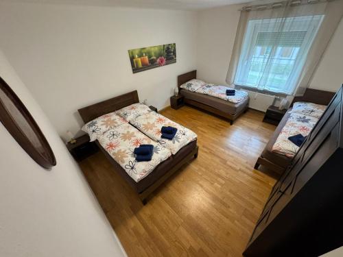 Postel nebo postele na pokoji v ubytování Apartment SNOW