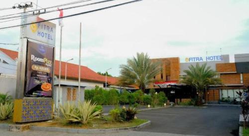 an empty parking lot in front of a hotel at Fitra Hotel Majalengka in Majalengka