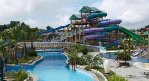 a large water park with a water slide at Labersa Grand Hotel &Convention Center in Pekanbaru
