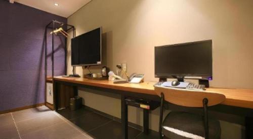 TV a/nebo společenská místnost v ubytování Gram Hotel